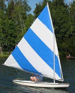 Blue and white striped Sunfish sail