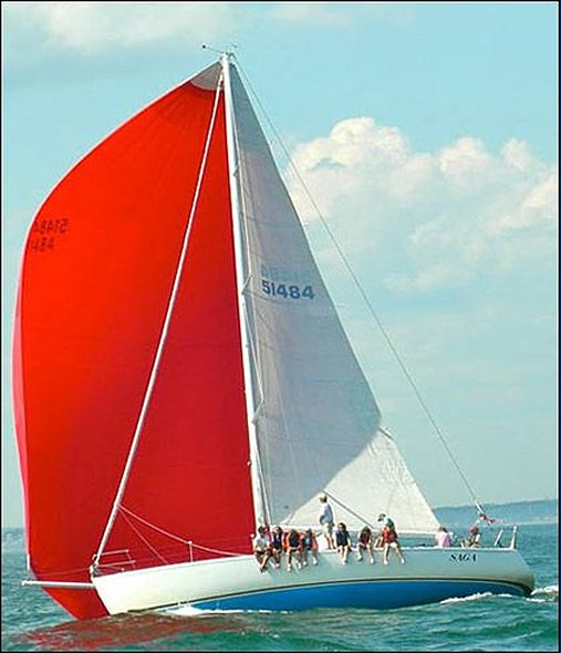 Keelboat with red spinnaker