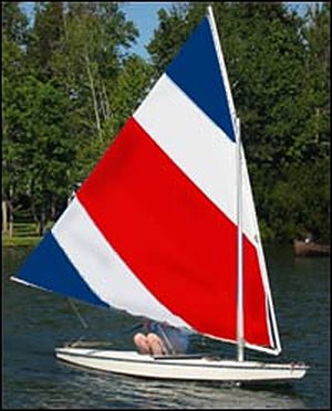 Red, white and blue Sunfish sail