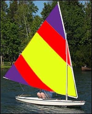 Red, yellow and purple Sunfish sail